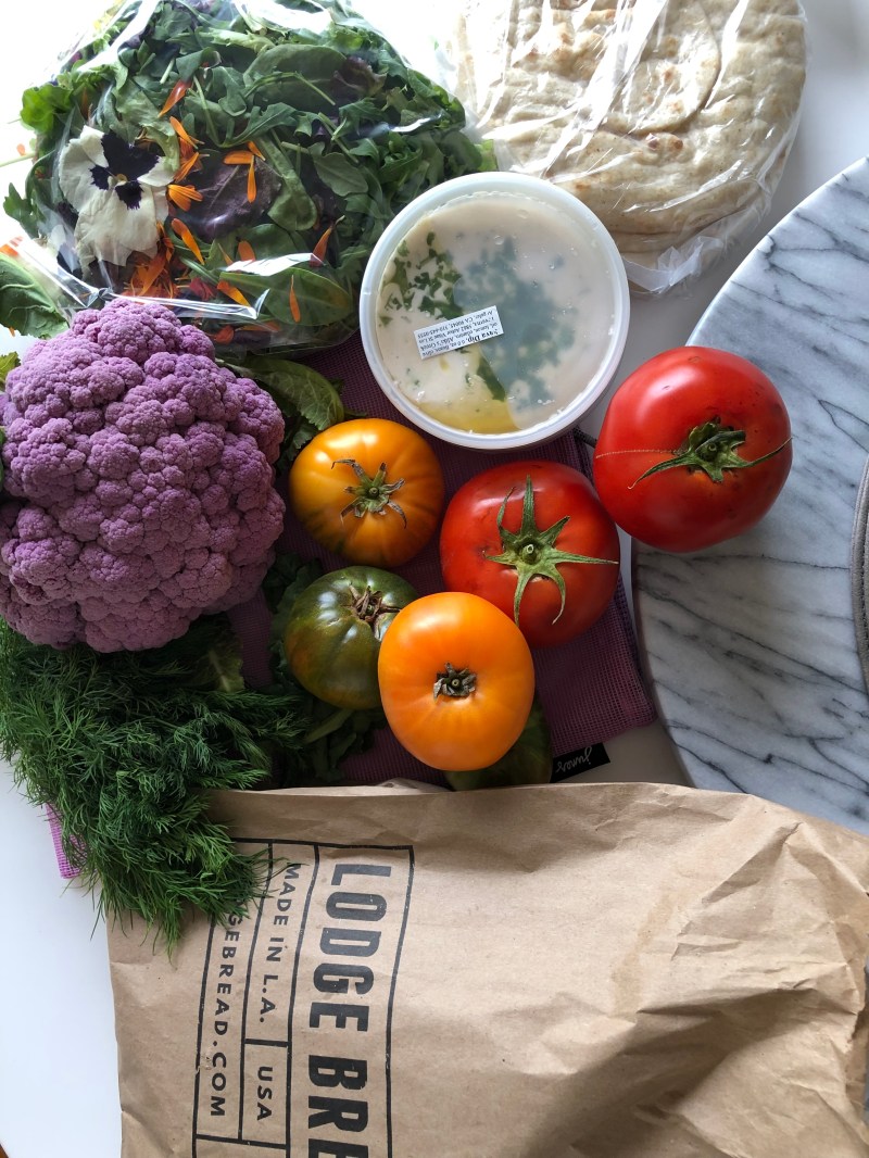 edible flowers, cauliflower, heirloom tomatoes, hummus, bread